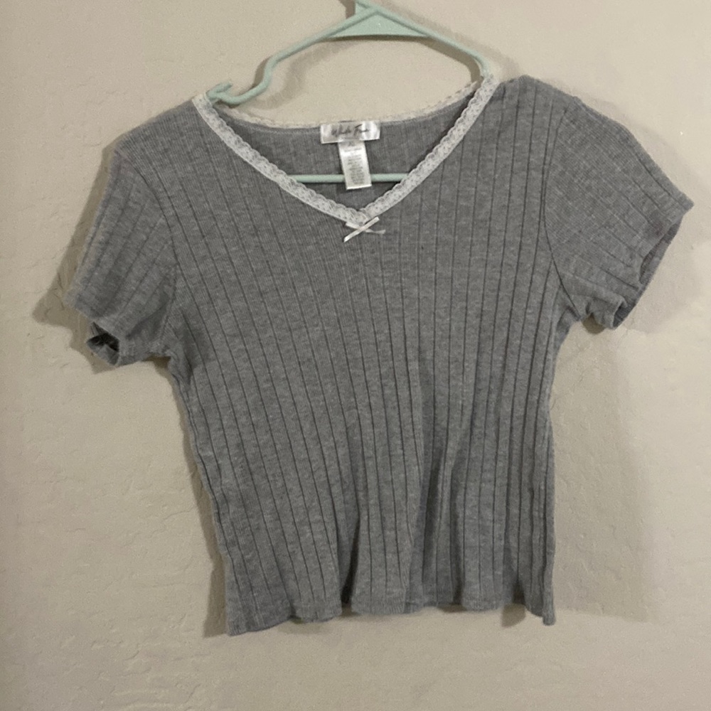 A gray cropped shirt with a lace neck